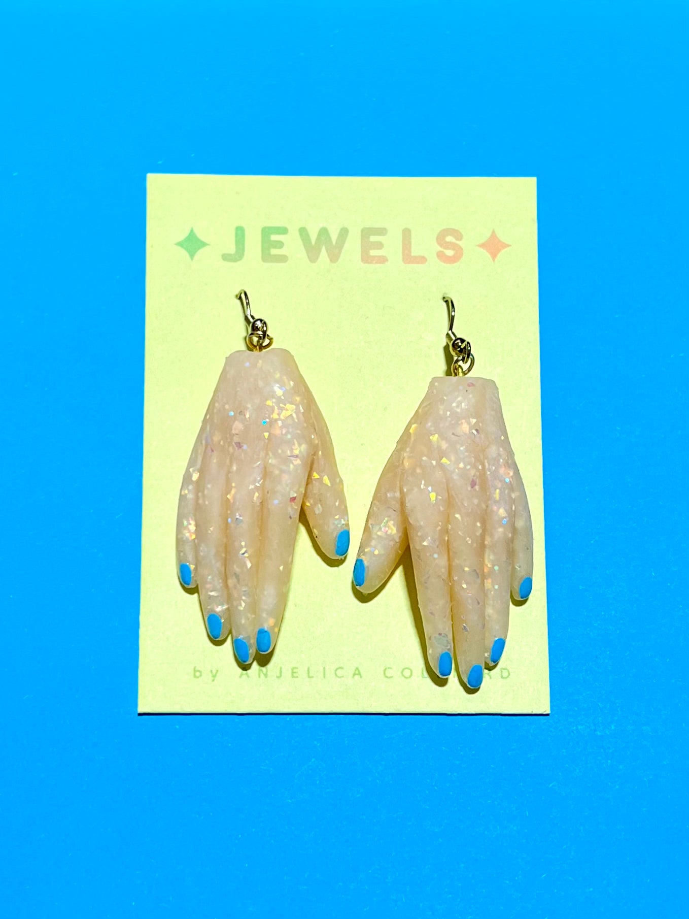 Jellicore Hand Earrings in Opal with Blue nails